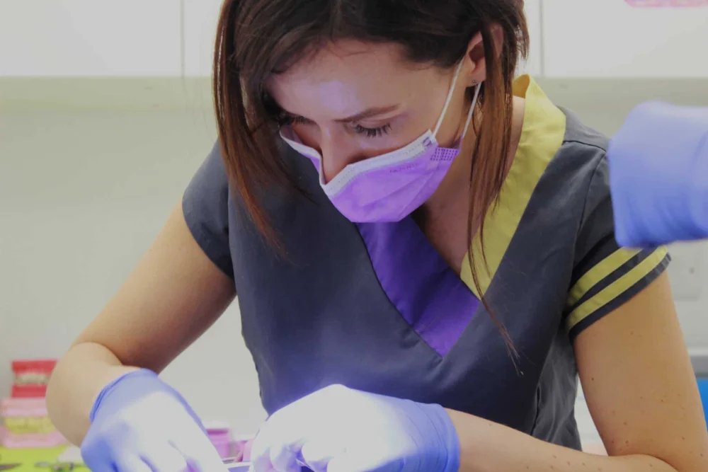 Paula Reed caring for a patient at Smileworks.